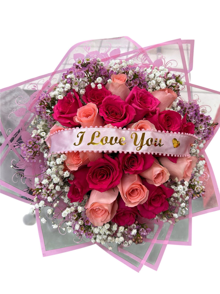 Bouquet of red and pink roses with 'I Love You' ribbon on a white background